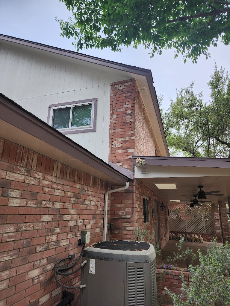 Completed gutter system on a Highlands Ranch home exterior after inspection and service